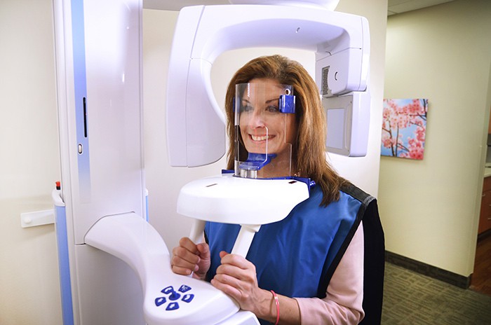 Smiling patient in x ray unit